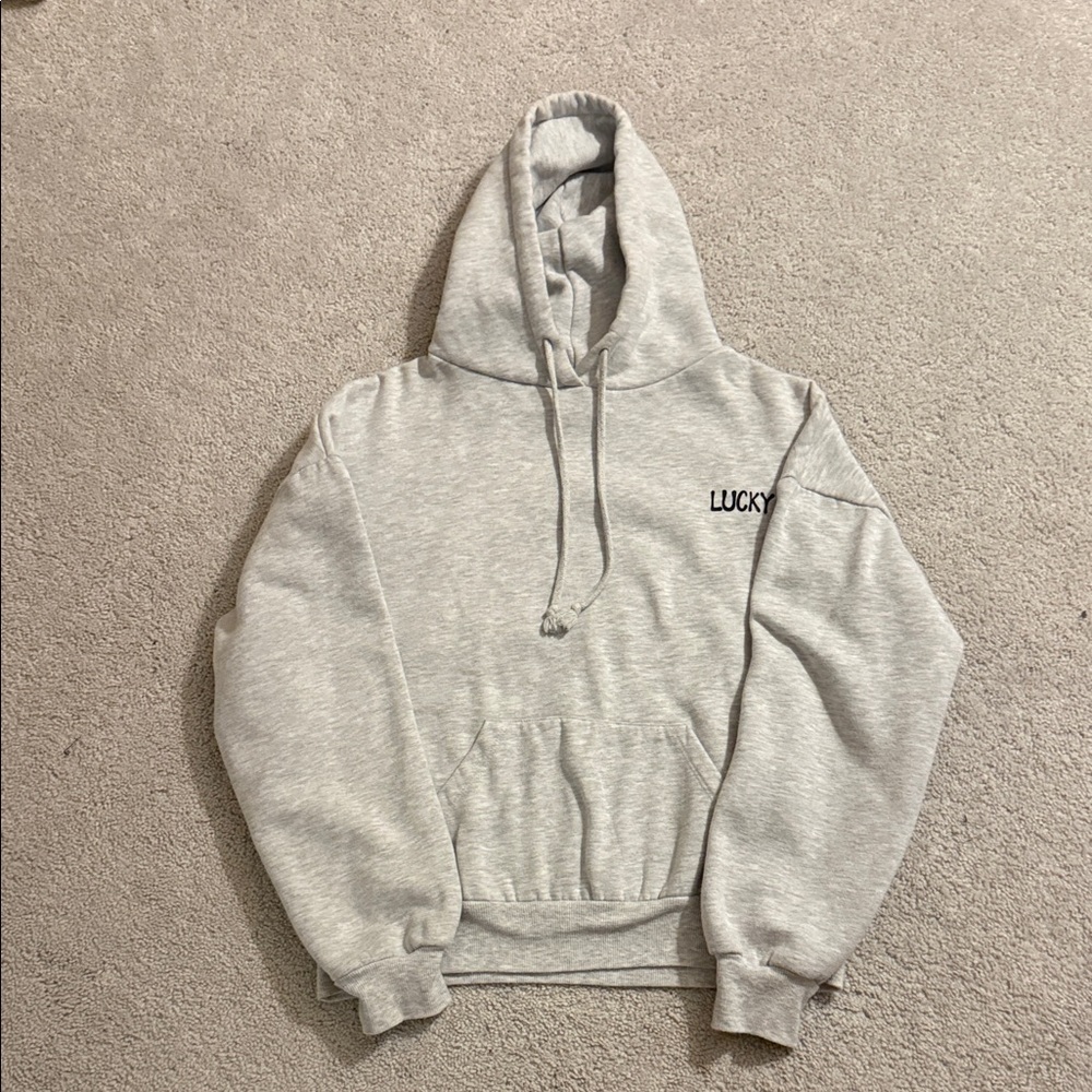 Subdued grey hoodie with blue star